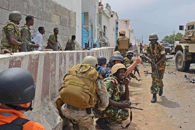 African Union peacekeepers take position outside the UN compound in Somalia