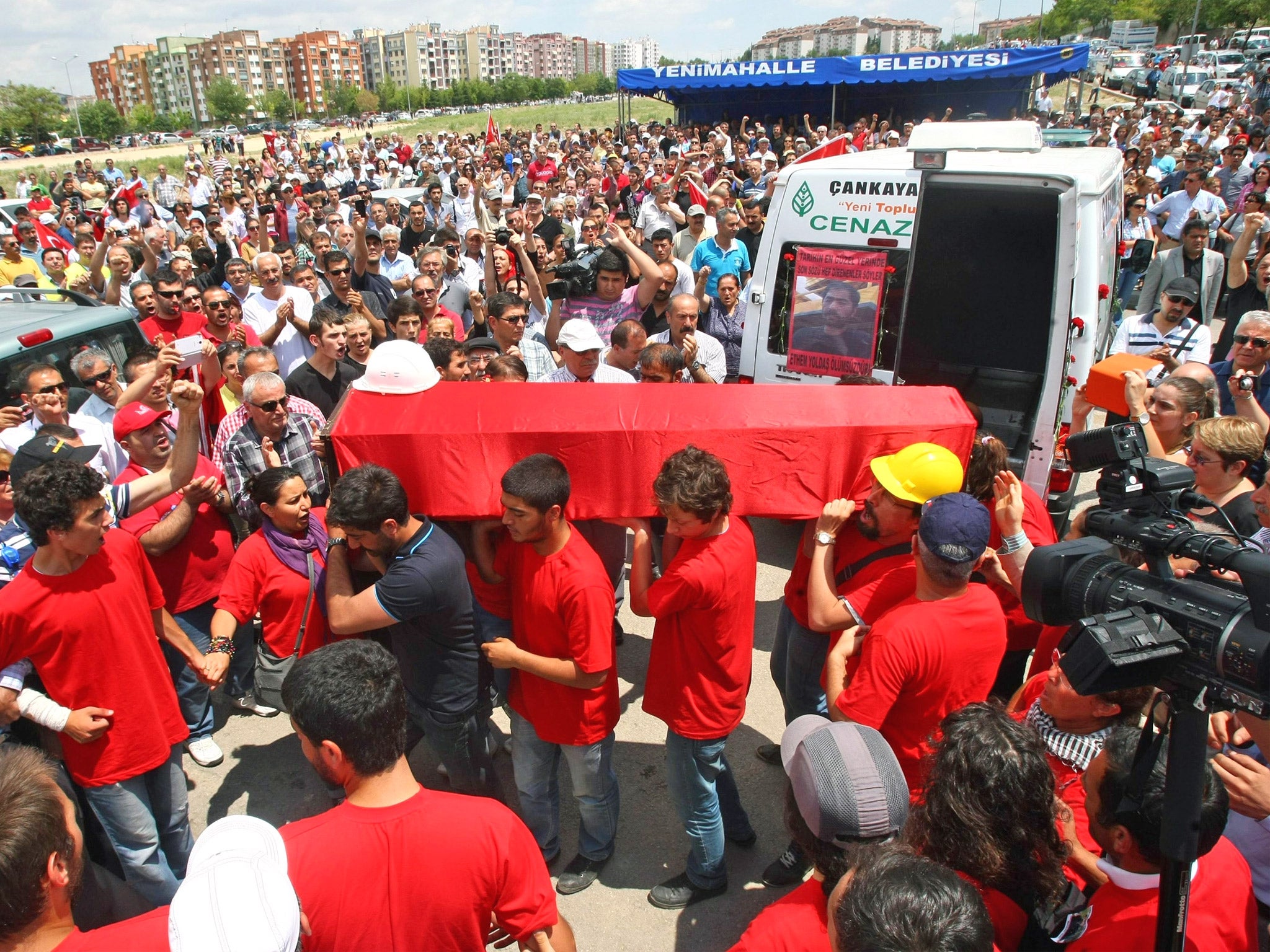 The coffin of Ethem Sarisuluk is carried at his funeral on Sunday