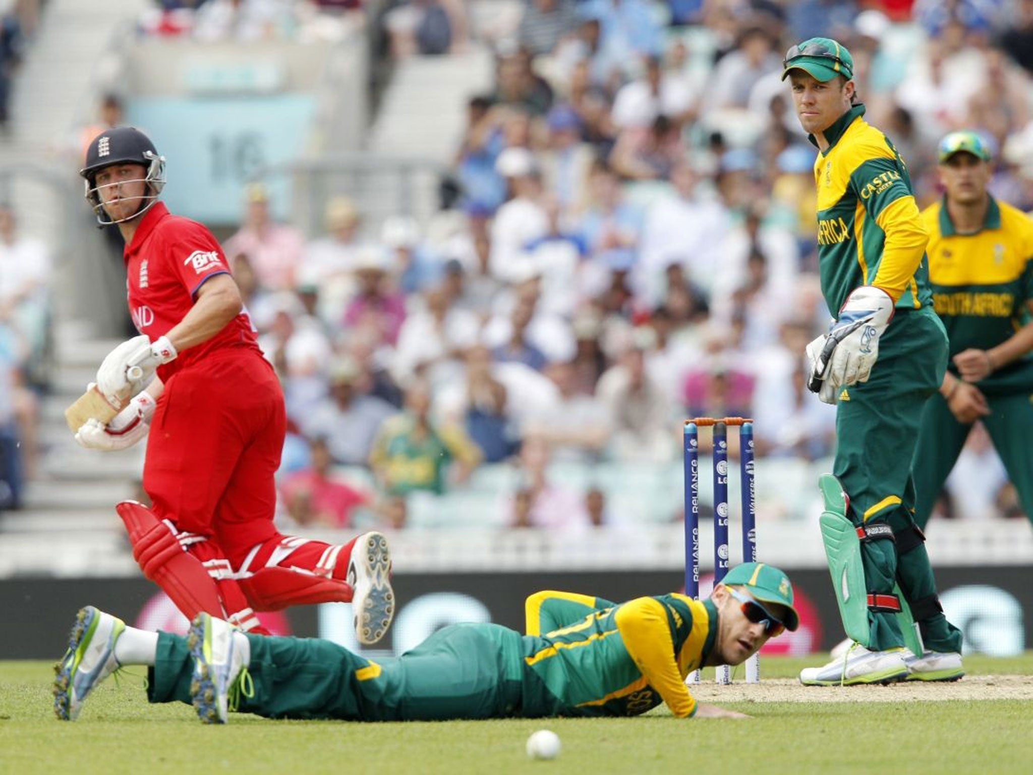 England's Johnathan Trott runs between the wickets as South African captain AB Devilliers