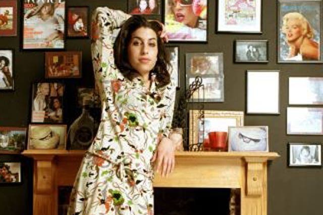 Amy Winehouse poses for photos at her home in Camden, London