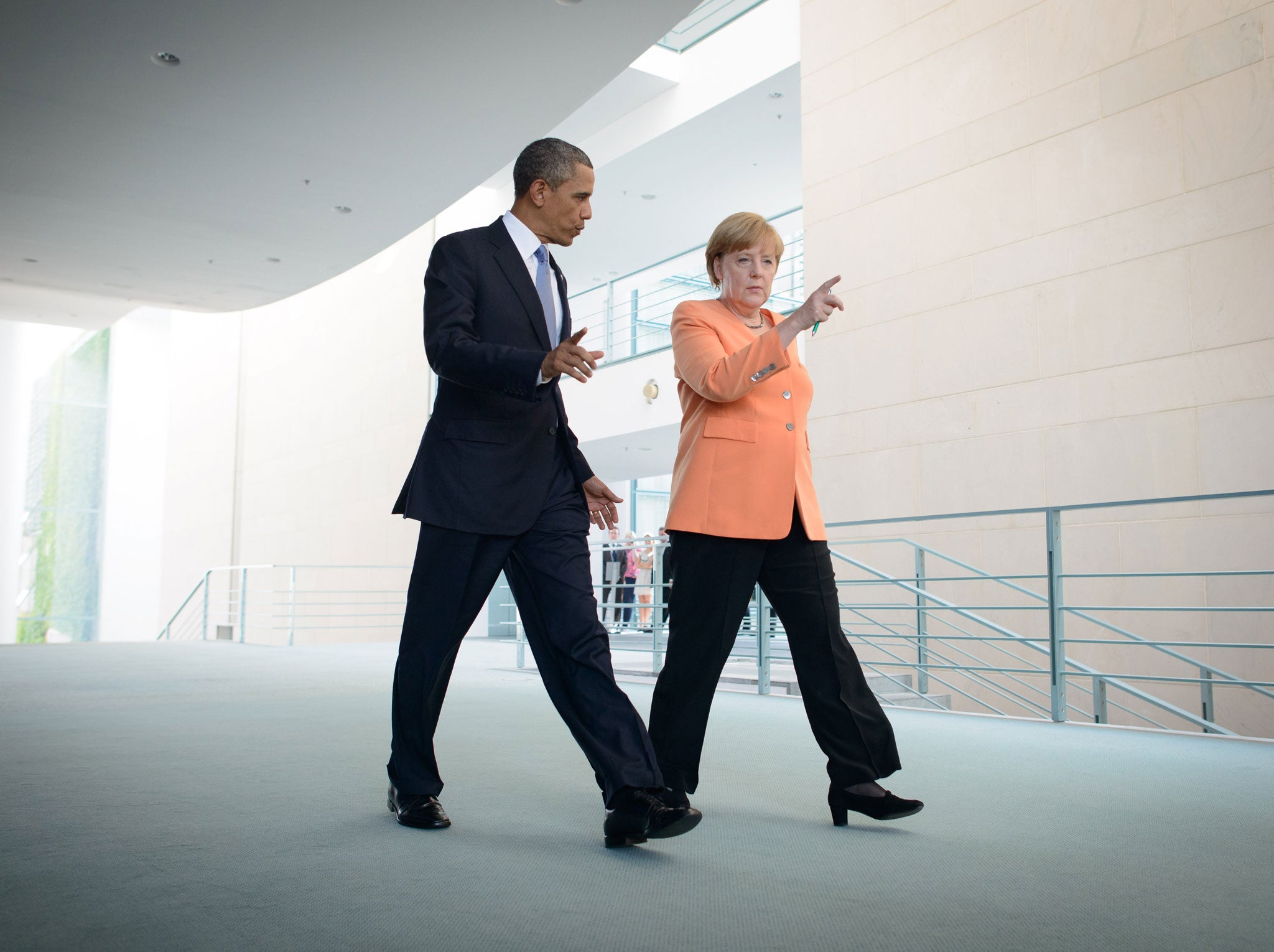 German Chancellor Anegela Merkel (R) and U.S. President Barack Obama (L) arrived to a press conference on June 19, 2013 in Berlin, Germany.