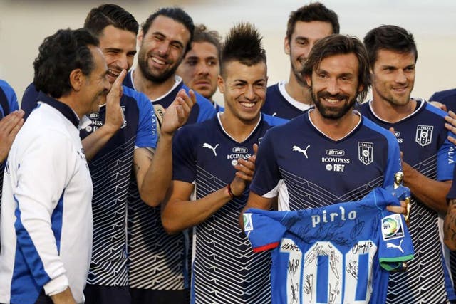 Andrea Pirlo, who won his 100th cap for Italy last week, is presented with a shirt signed by all his Azzurri team-mates