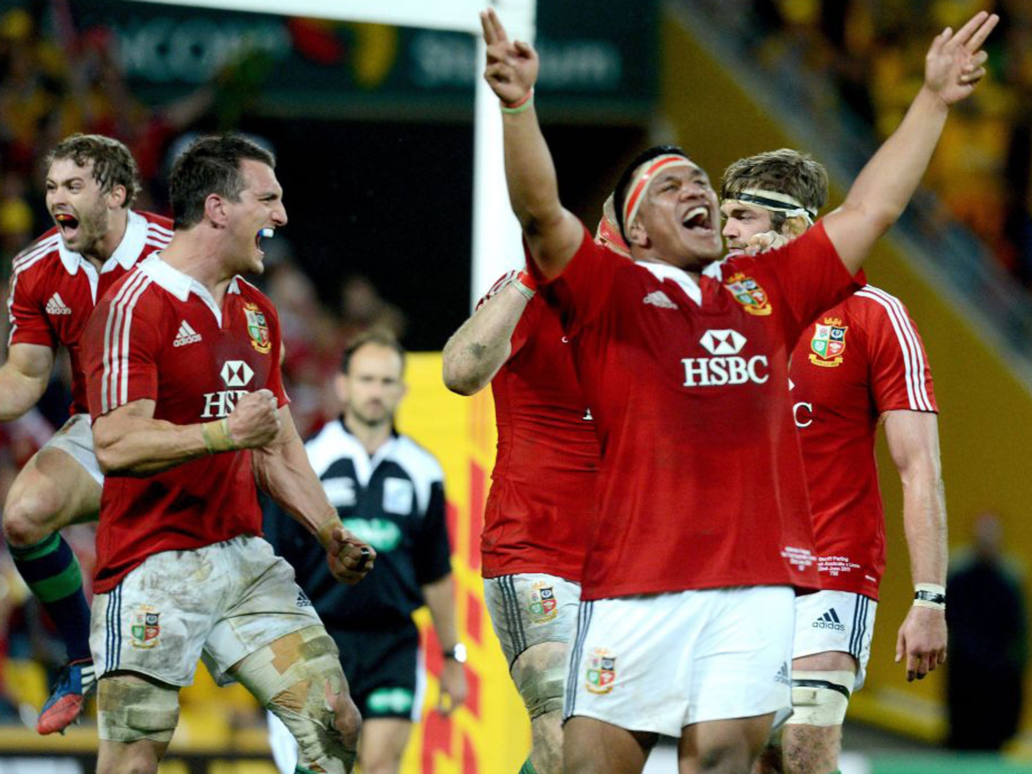 Lions players celebrate after the final whistle, moving a step closer to winning the series (Dave Hunt/EPA)