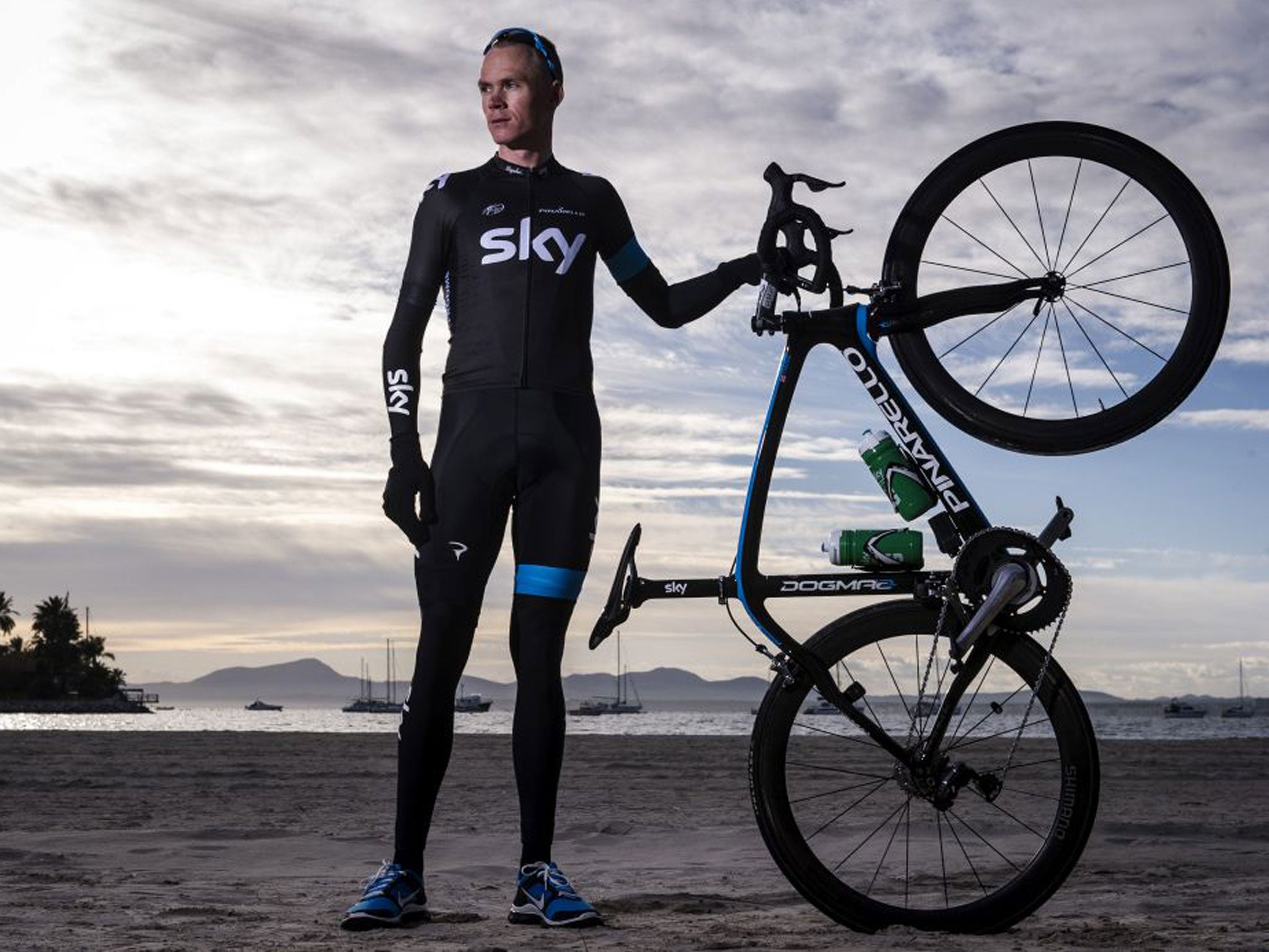 Chris Froome poses with his bike on a Spanish beach ahead of the serious action, which starts next week