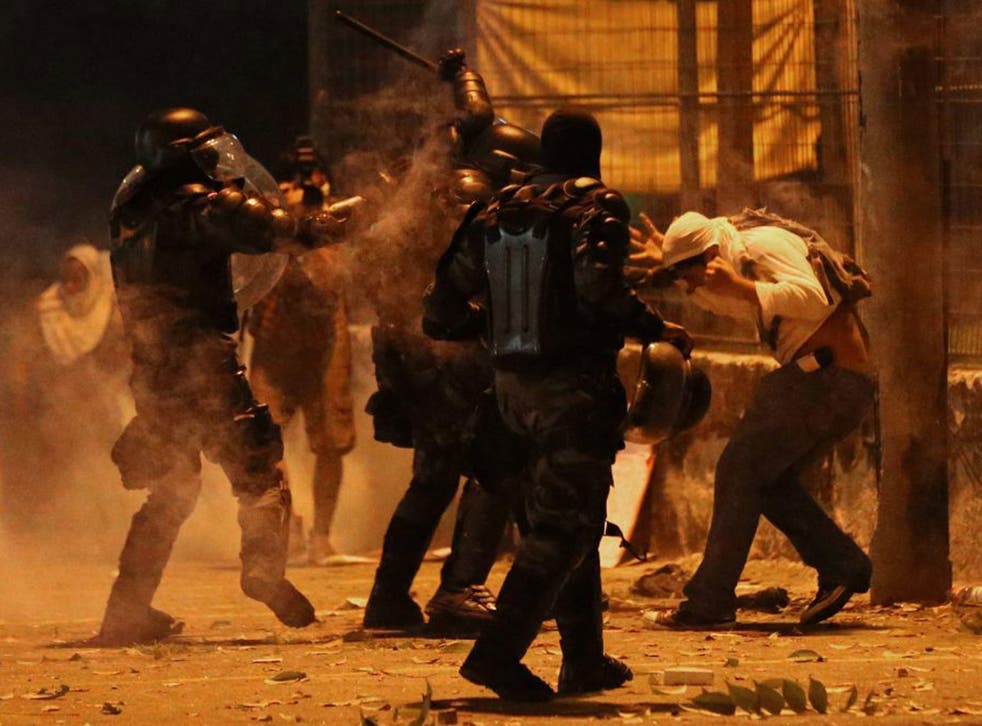 Gas attack: Riot police go into heavy-handed action against one of the 300,000 demonstrators on the streets of Rio