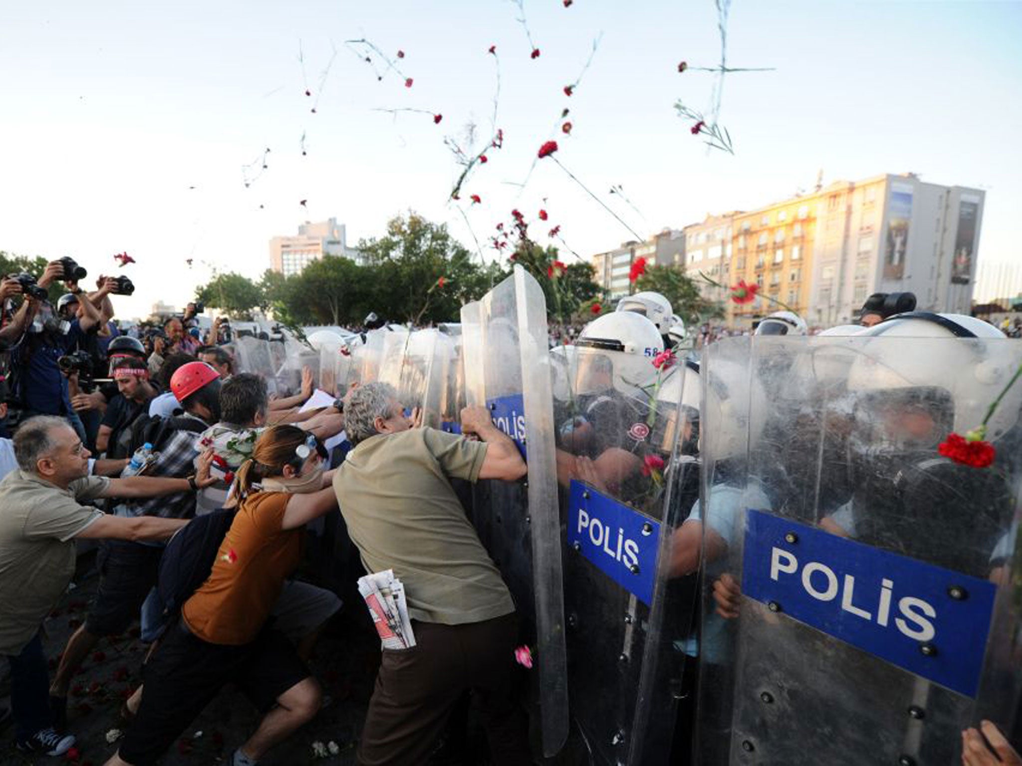 Protesters shower police with blooms in Taksim Square yesterday