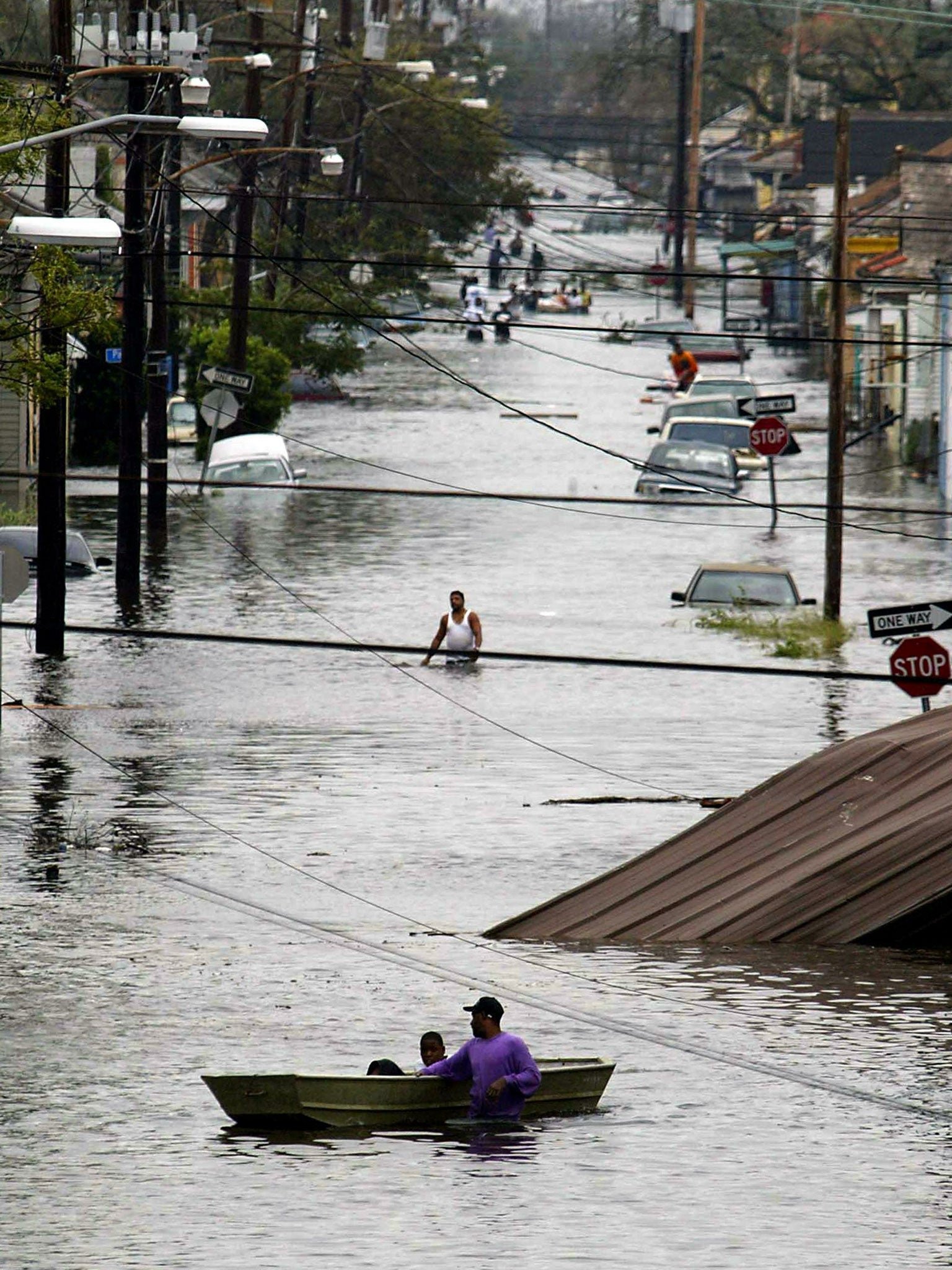 Katrina left 800,000 people homeless in New Orleans in 2005. Right, Sandy on satellite