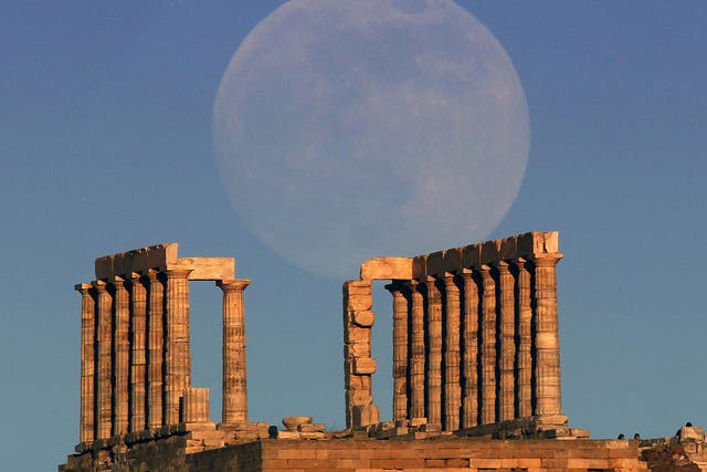 The ‘Supermoon’ rises over the temple of Poseidon, near Athens