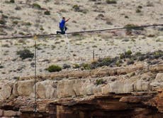 Don't look down! Nik Wallenda crosses the Grand Canyon on just two inches of steel rope 