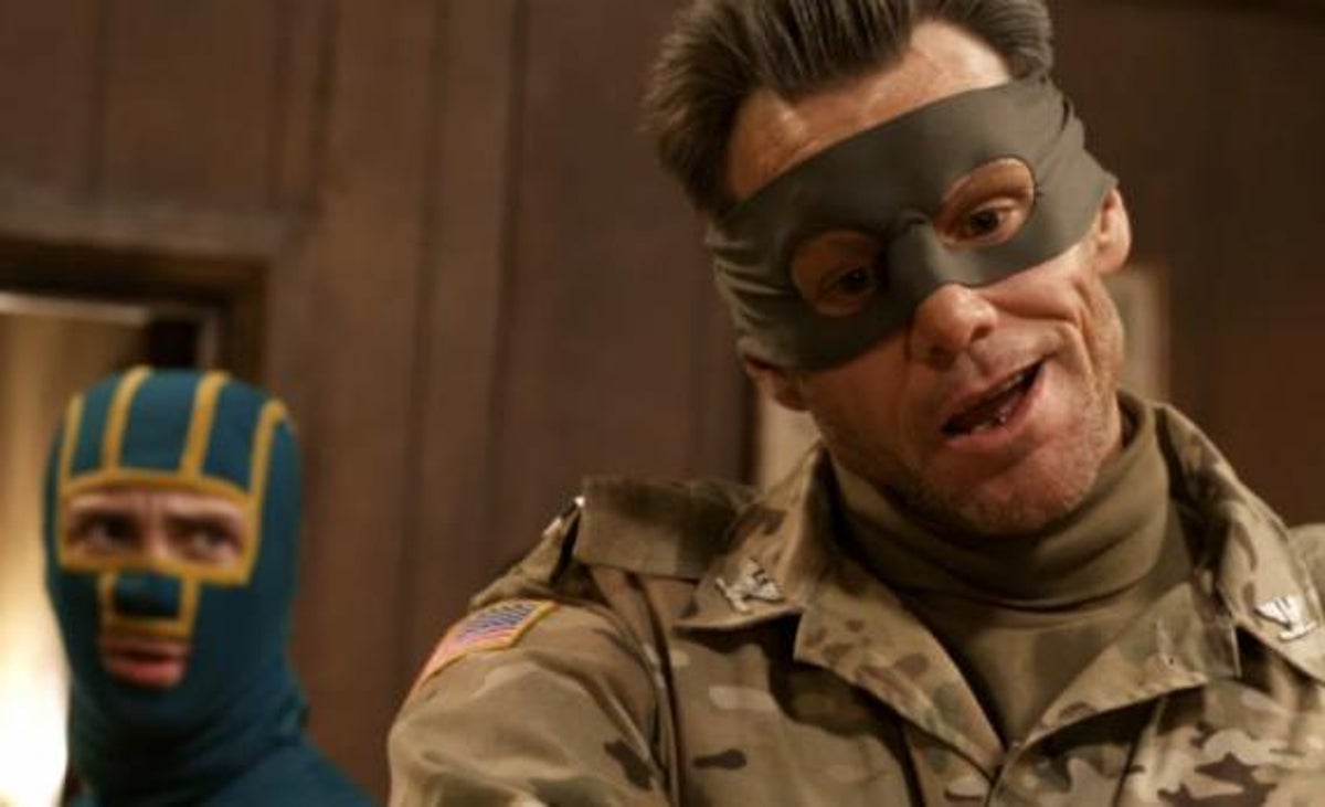 Carrey wearing camo and and a bandit / eye mask with a crew-cut haircut inKick Ass 2