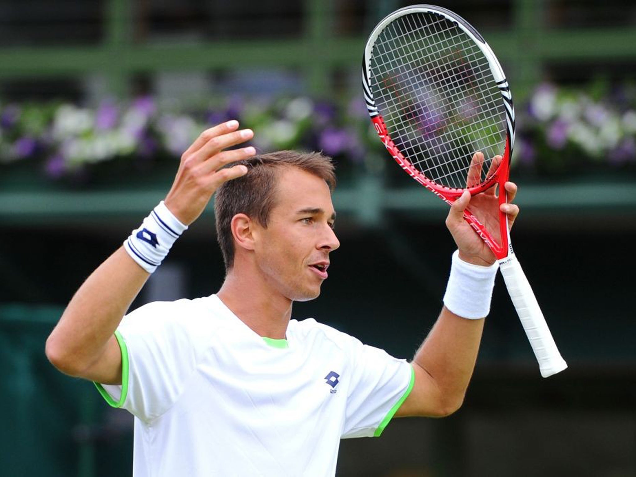 Last year's giant-killer Lukas Rosol as he made a first-round exit after defeat to Julian Reister