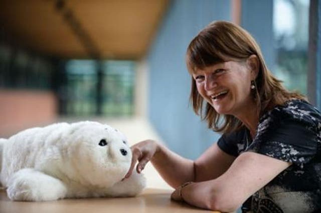 Professor Glenda Cook of Northumbria University with the robotic harp seal