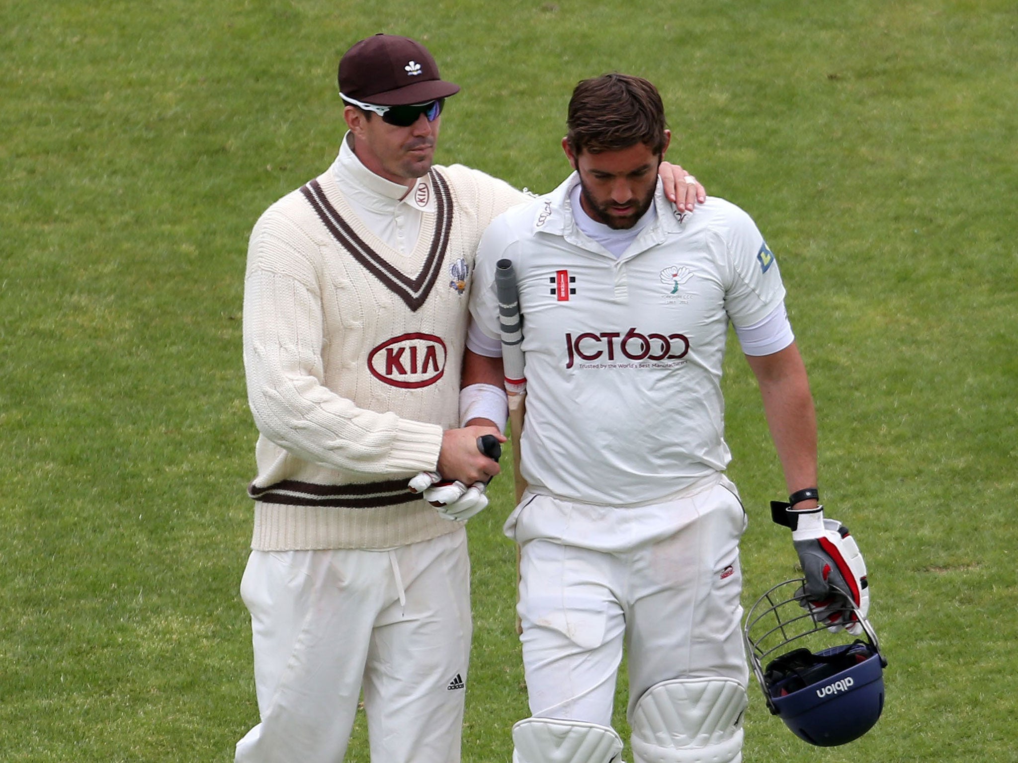Kevin Pietersen (left) consoles Yorkshire's Liam Plunkett after his dismissal for 68