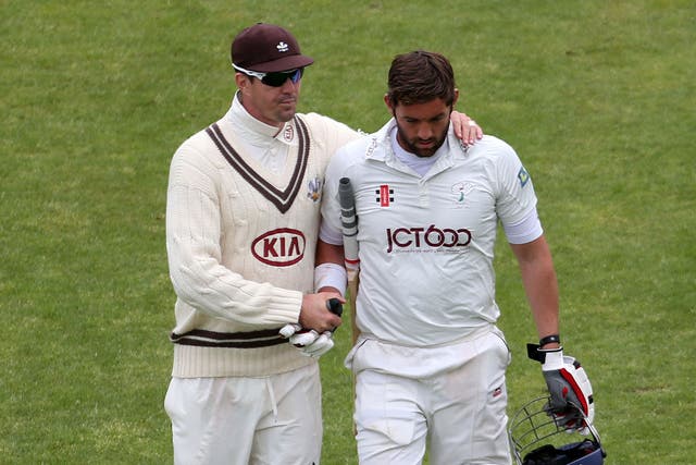 Kevin Pietersen (left) consoles Yorkshire's Liam Plunkett after his dismissal for 68