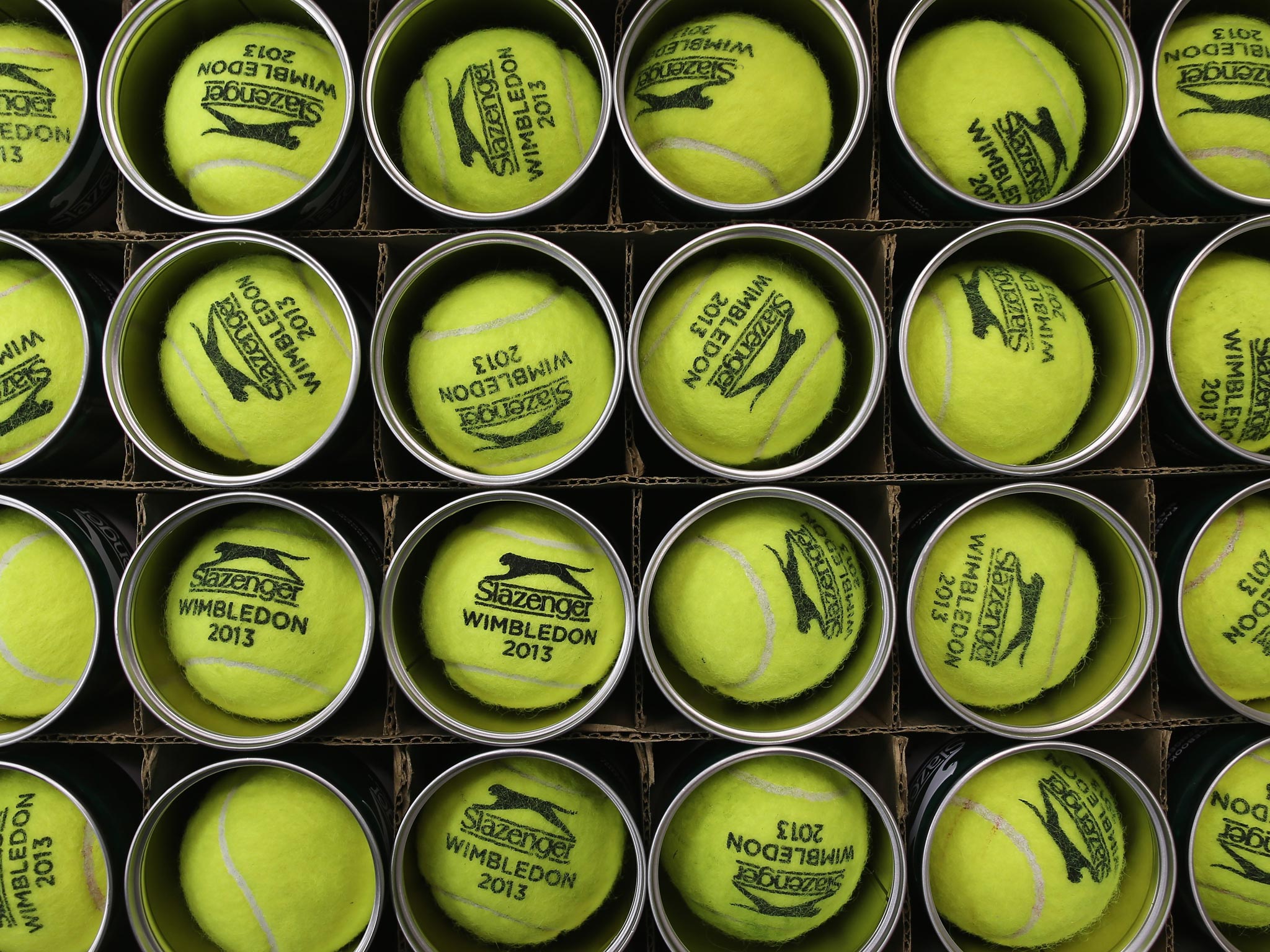 25 June 2013: Used tennis balls are boxed up on day two of the Wimbledon Lawn Tennis Championships
