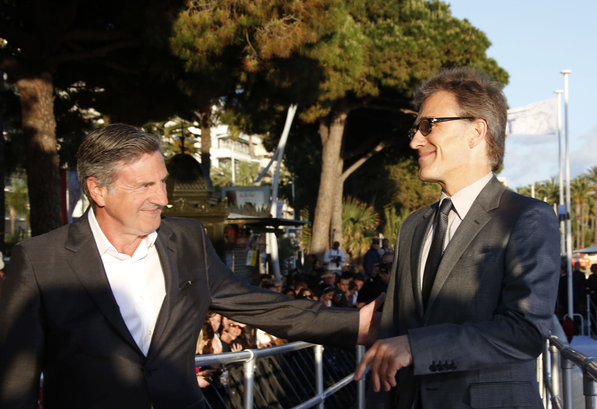 French actor and member of the Feature Film Jury Daniel Auteuil (L) and Austrian actor and member of the Feature Film Jury Christoph Waltz arrive to take part in the TV show 'Le Grand Journal'