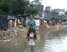 Indian TV reporter defends decision to do live piece to camera from shoulders of recently rescued Uttarakhand flood victim