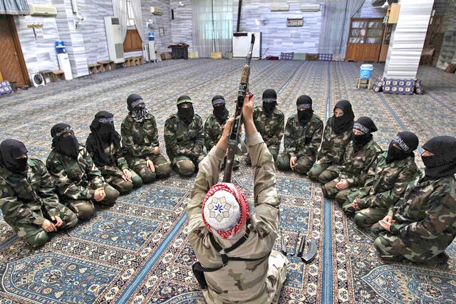 Abu al-Taib, leader of the Ahbab Al-Mustafa Battalion, addresses female recruits in Aleppo