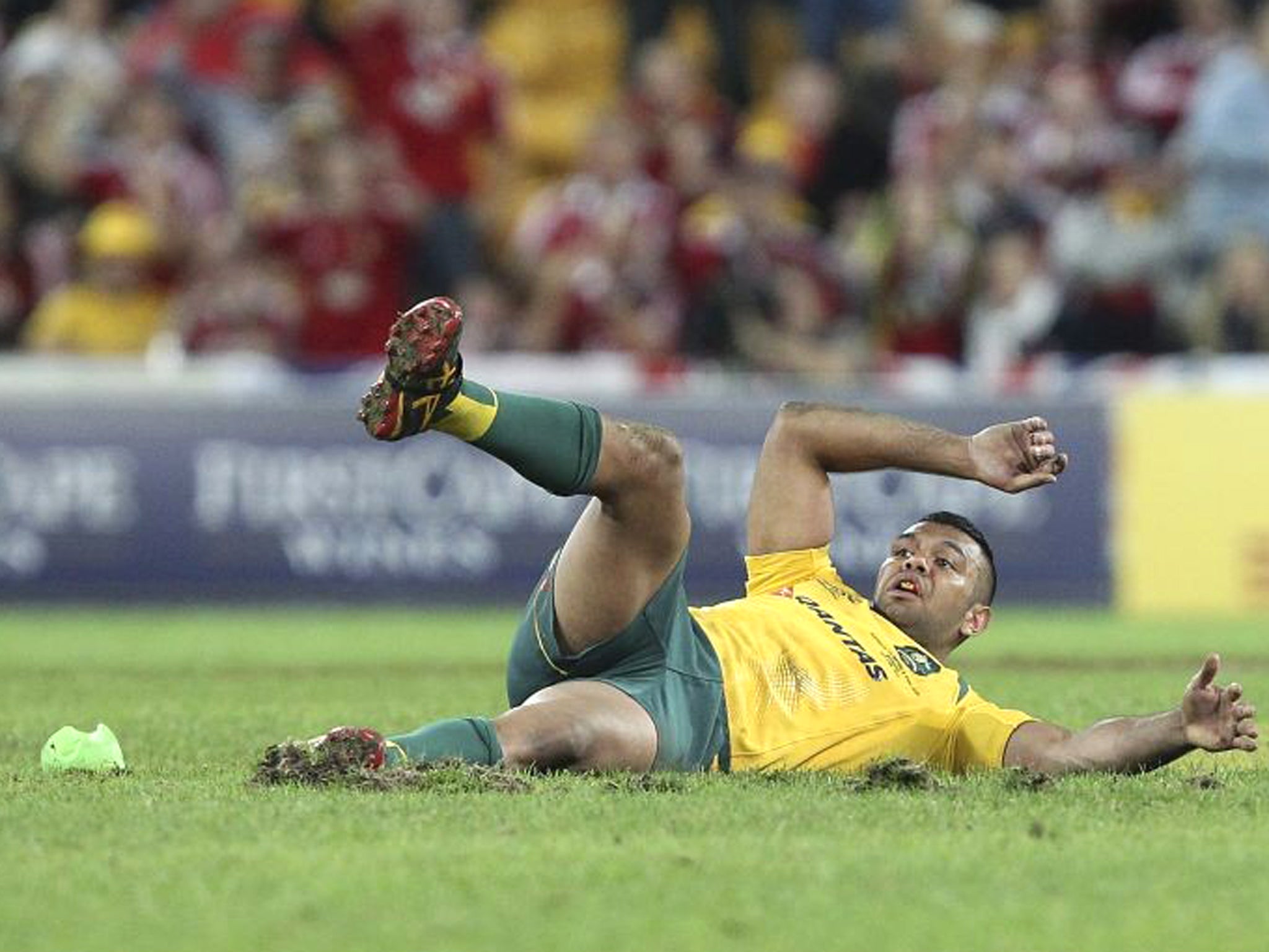Kurtley Beale slips and falls as he fails to kick the final penalty which would have given Australia victory against the British and Irish Lions during the First test match in Brisbane