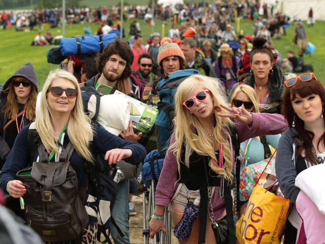 Festival goers arriving for Glastonbury Festival at Worthy Farm in Somerset