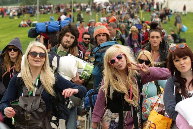 Festival goers arriving for Glastonbury Festival at Worthy Farm in Somerset