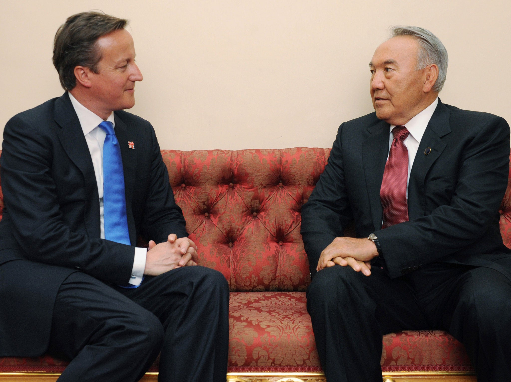 Prime Minister David Cameron chats with President of Kazakhstan Nursultan Nazarbayev at a reception at Buckingham Palace for Heads of State and Government attending the Olympics Opening Ceremony on July 27, 2012 in London, England.