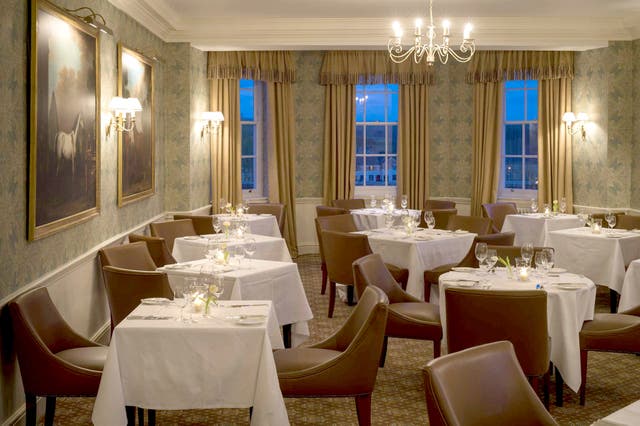 Resorting to repro: The dining room ends in a huge bay window overlooking the sublime countryside leading to Castle Howard