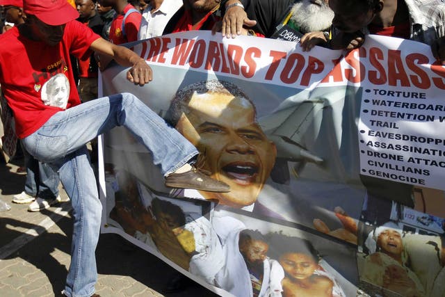 South African protesters campaign against President Barack Obama’s three-nation tour of the continent