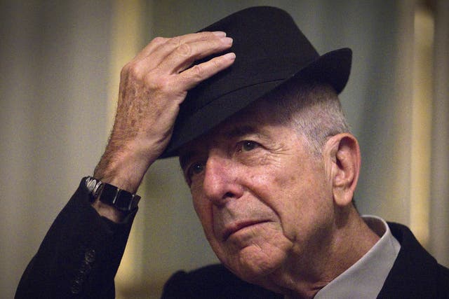 Canadian singer and poet Leonard Cohen takes off his hat to salute on January 16, 2012 in Paris.