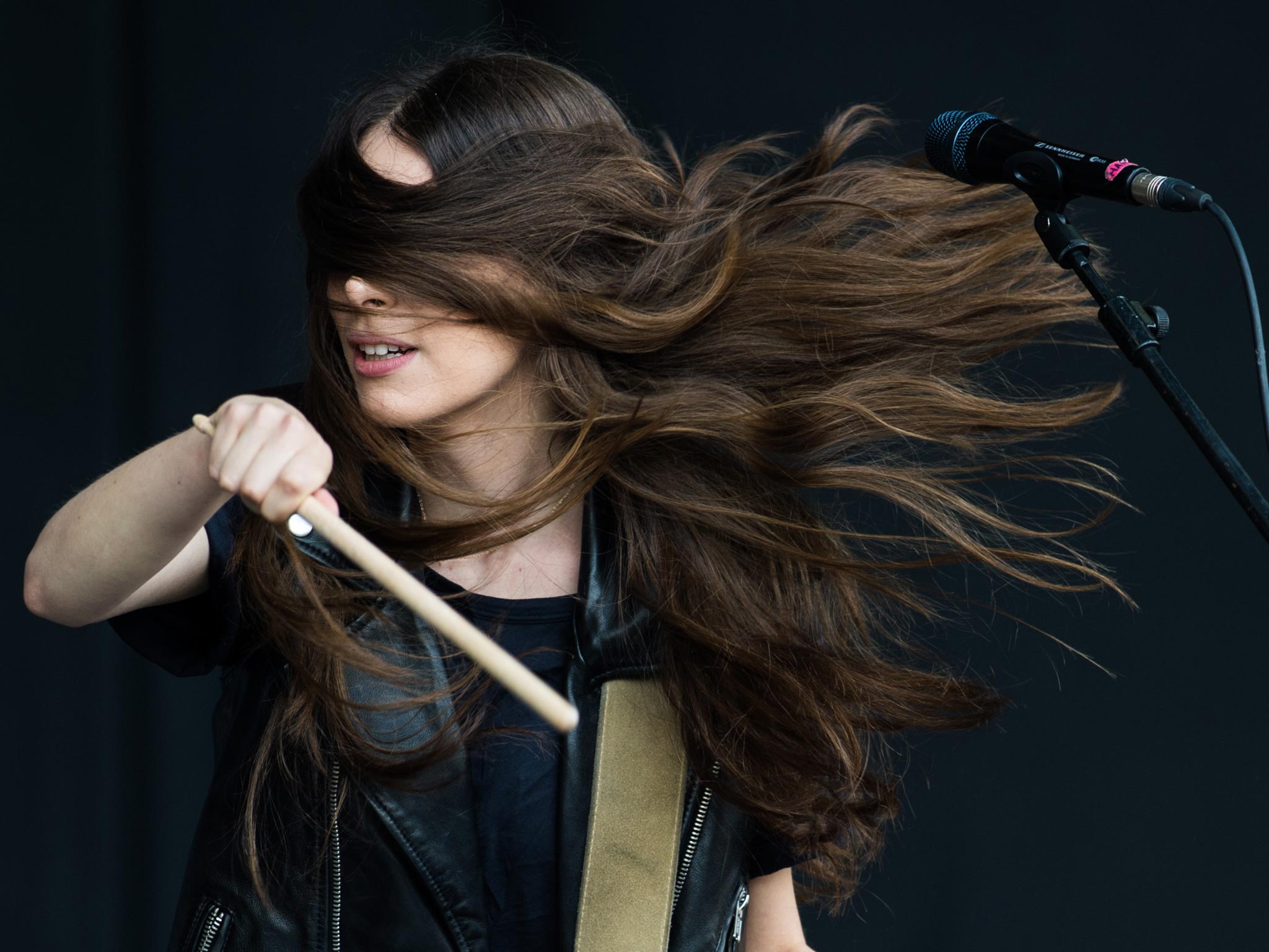 Danielle Haim of 'Haim' performs live on the Pyramid Stage at day 2 of the 2013 Glastonbury Festival