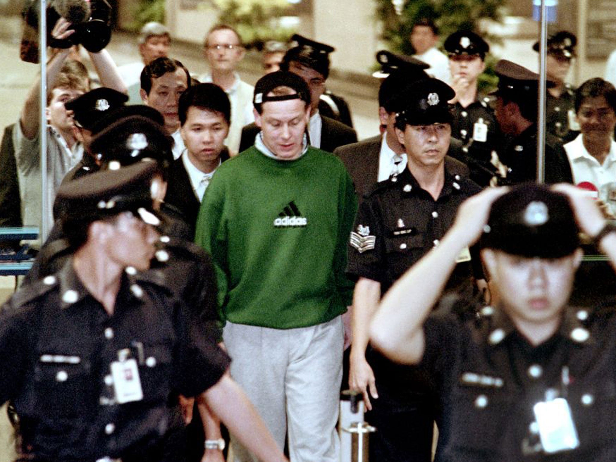 Nick Leeson arrives back at Changi airport in November 1995 after being extradited from Germany