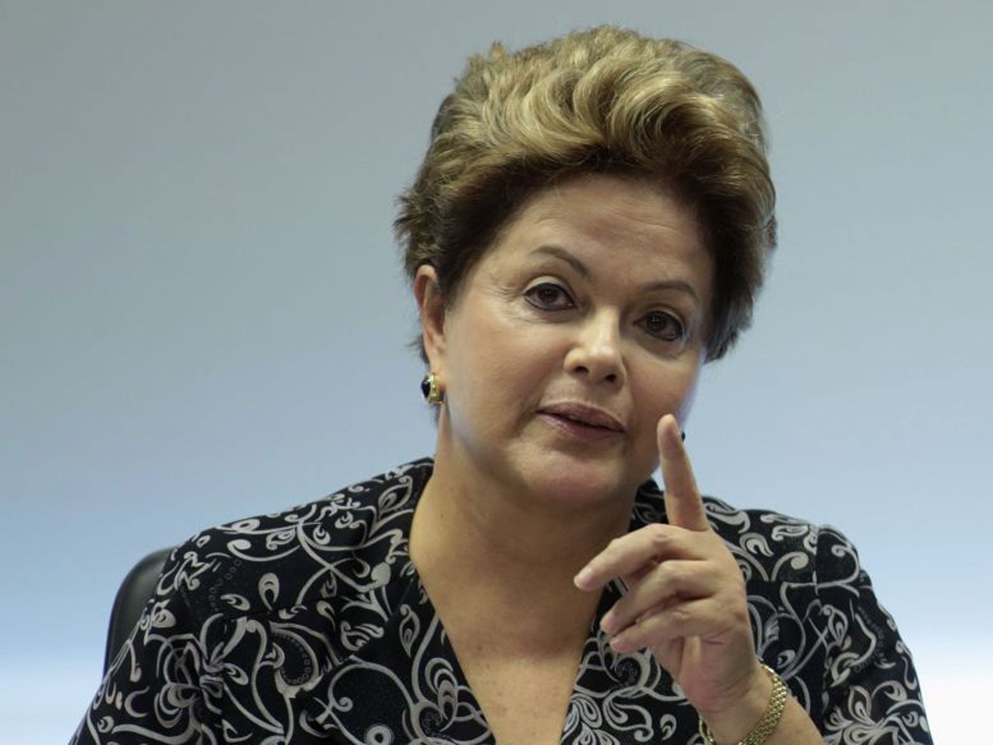 Brazil's President Dilma Rousseff gestures during a meeting with representatives from youth movement groups at the Planalto Palace
