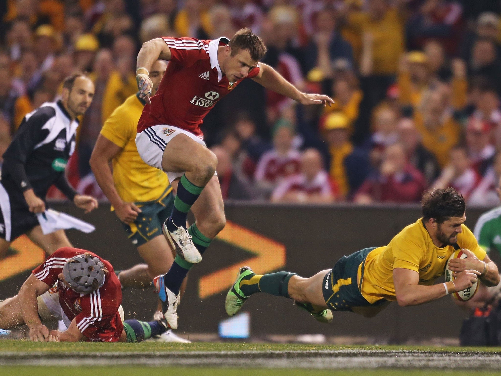 Gold Rush: Australia’s Adam Ashley-Cooper dives over for the only try in his side’s victory against the Lions in Melbourne