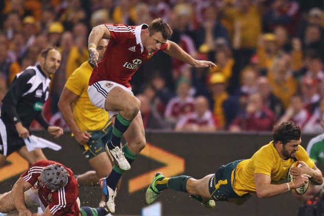 Gold Rush: Australia’s Adam Ashley-Cooper dives over for the only try in his side’s victory against the Lions in Melbourne