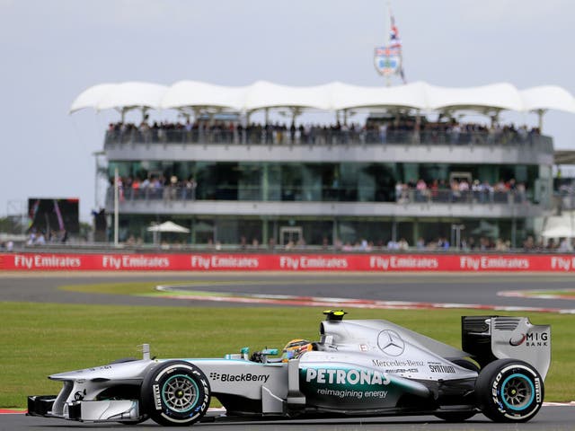 Local hero Lewis Hamilton claims pole