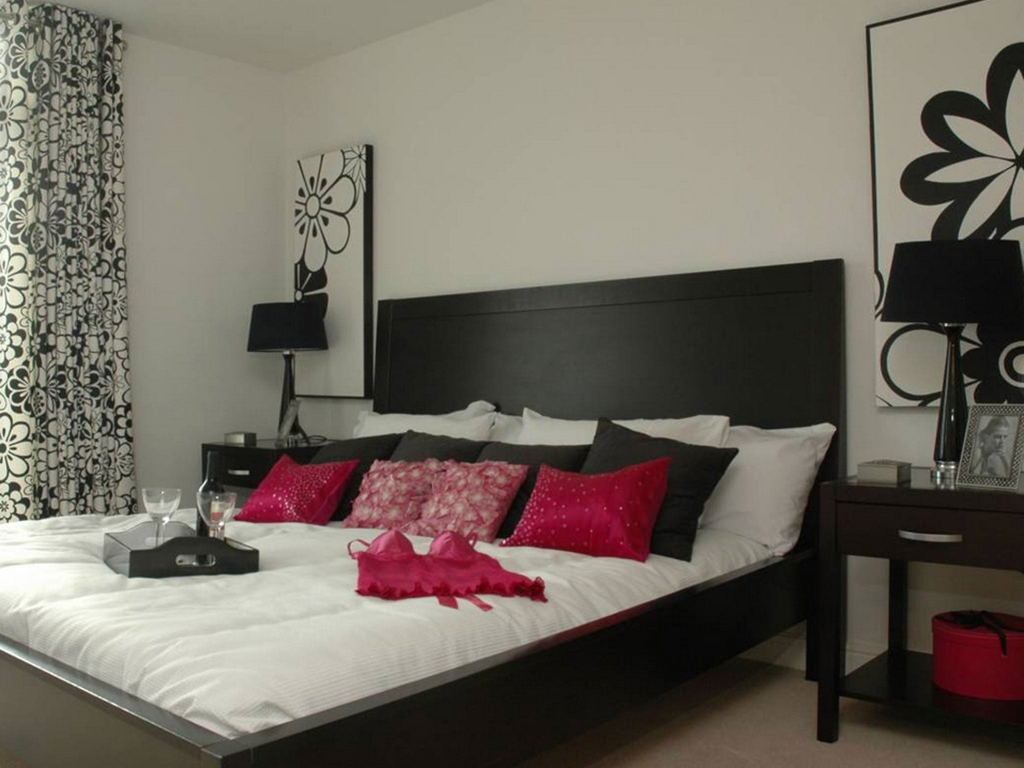 An enterprising vendor in east London has given their bedroom a boudoir feel by leaving a racy fuchsia negligee, complete with bottle of red and two glasses on the bed for the estate agent’s snapper to capture
