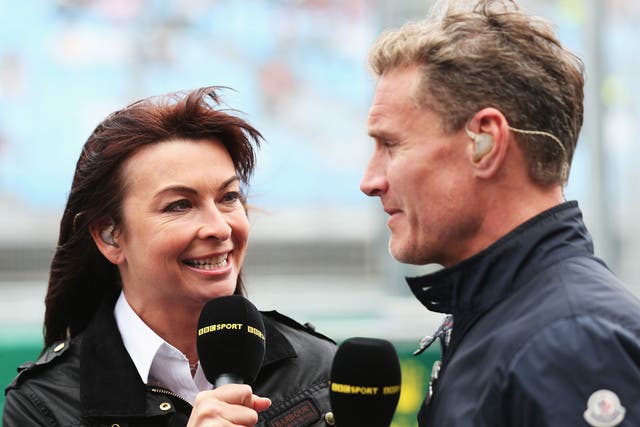 BBC F1 presenter Suzi Perry, left, talks with former F1 driver David Coulthard, right, in the paddock 