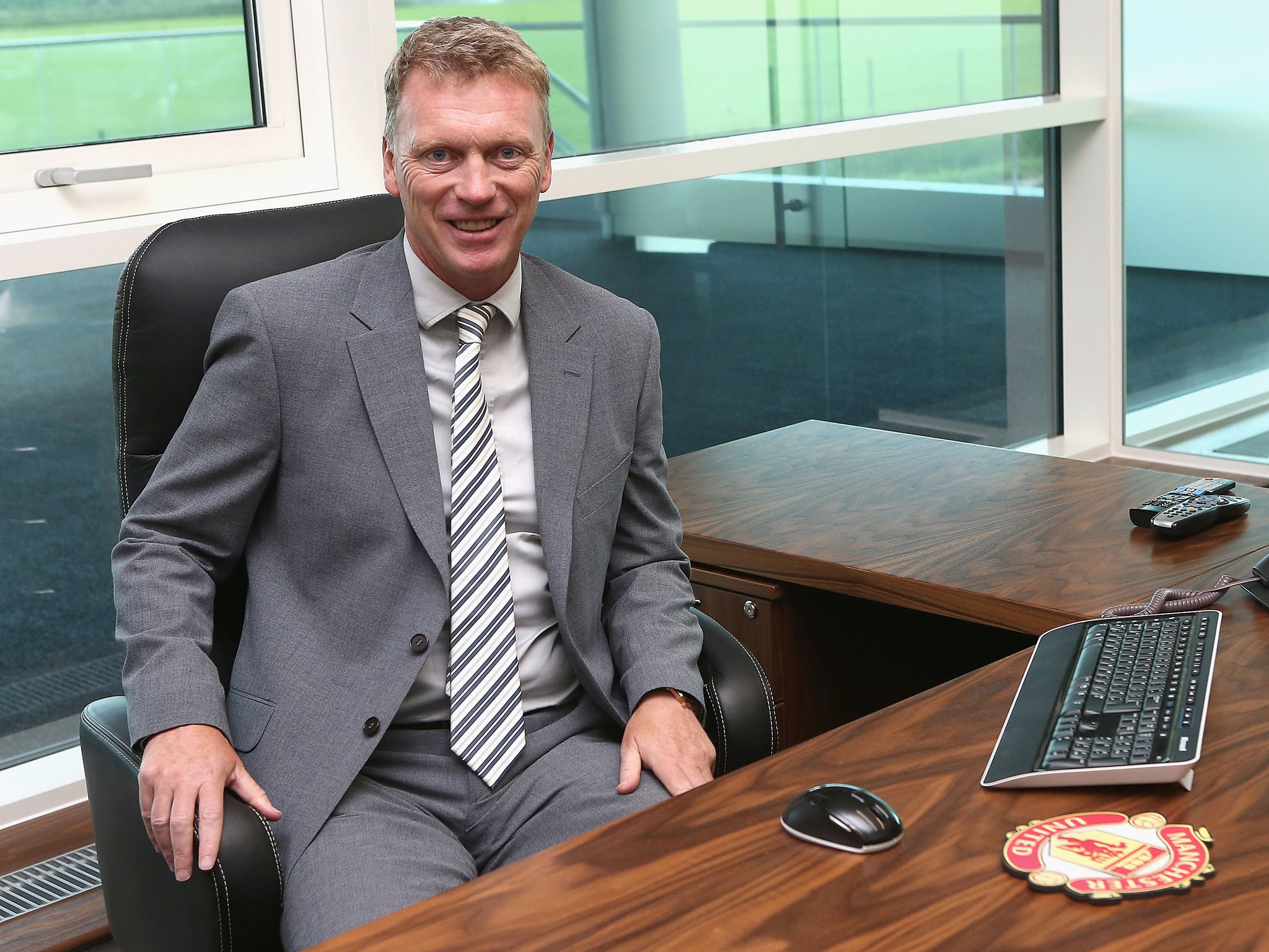 David Moyes gets to grips with his new office on his first day as Manchester United manager