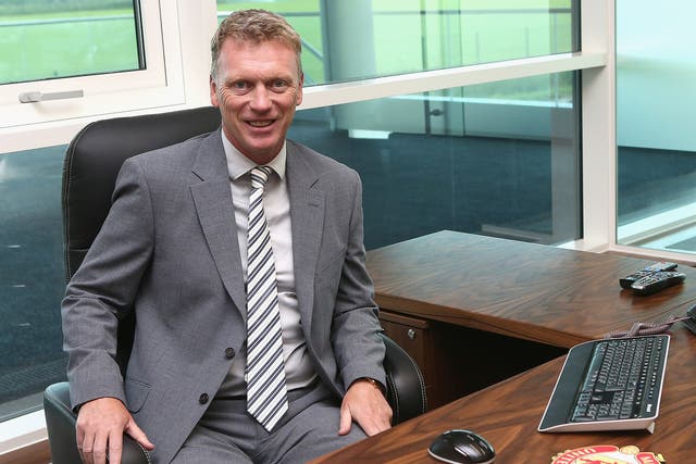 David Moyes gets to grips with his new office on his first day as Manchester United manager