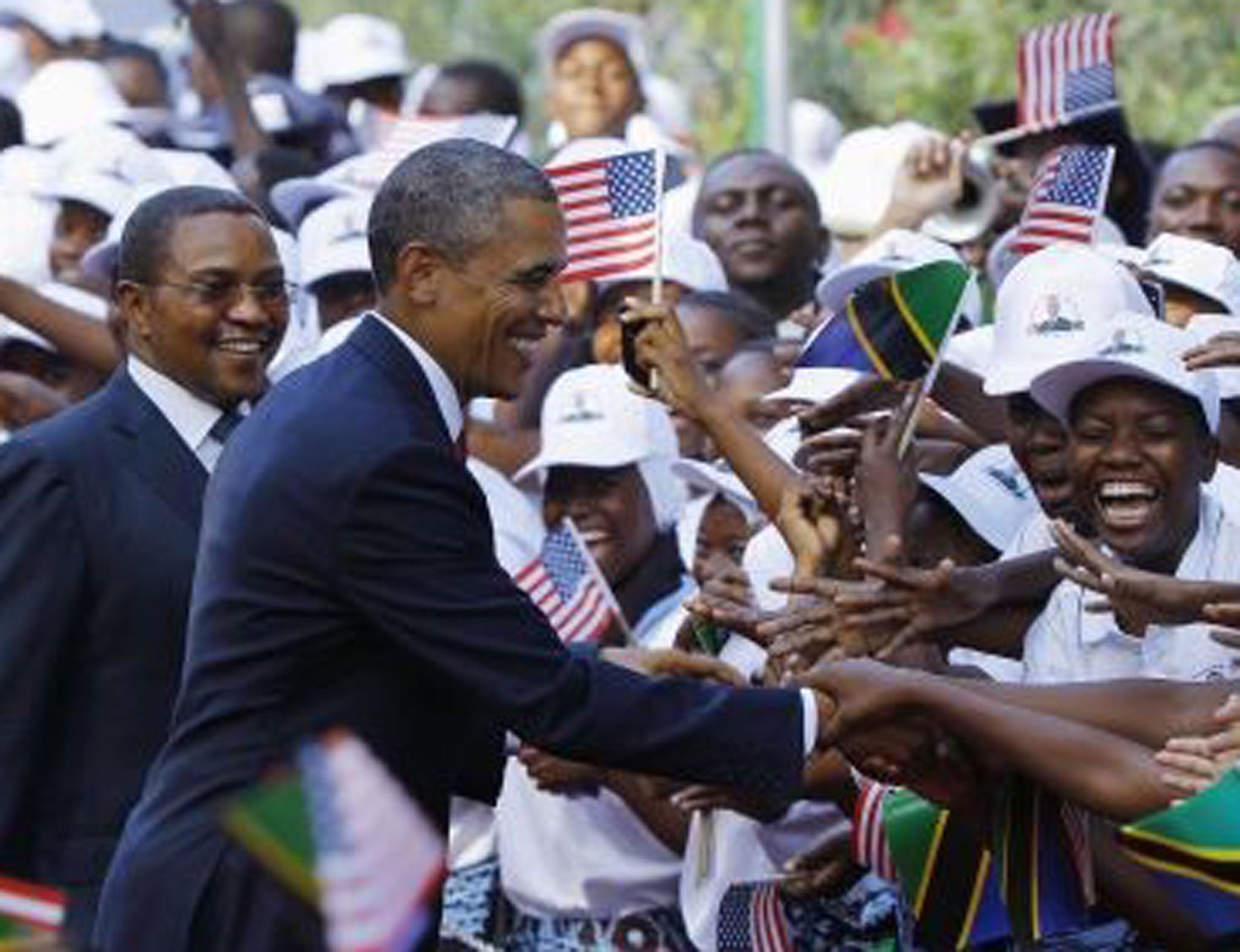 Barack Obama and Tanzania's President Jakaya Kikwete, left, at a welcoming ceremony in Dar Es Salaam