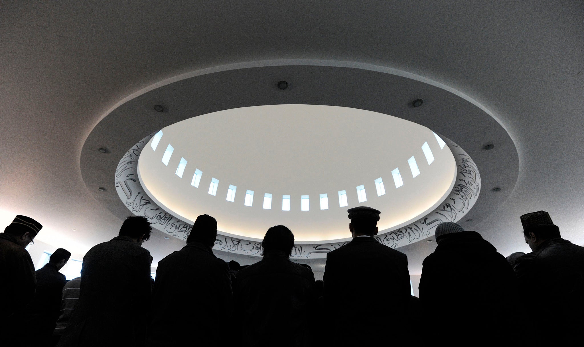 Muslims stand in the prayer hall during Friday prayers in Baitul Futuh Mosque in south London. Channel 4 will broadcast the call to prayer live during Ramadan.