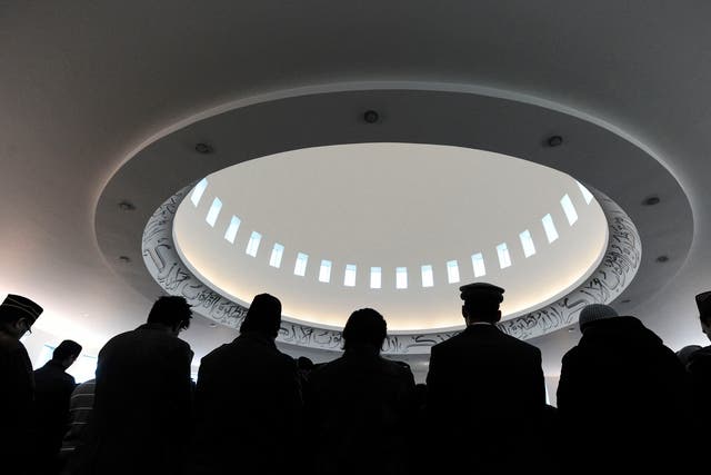 Muslims stand in the prayer hall during Friday prayers in Baitul Futuh Mosque in south London. Channel 4 will broadcast the call to prayer live during Ramadan.
