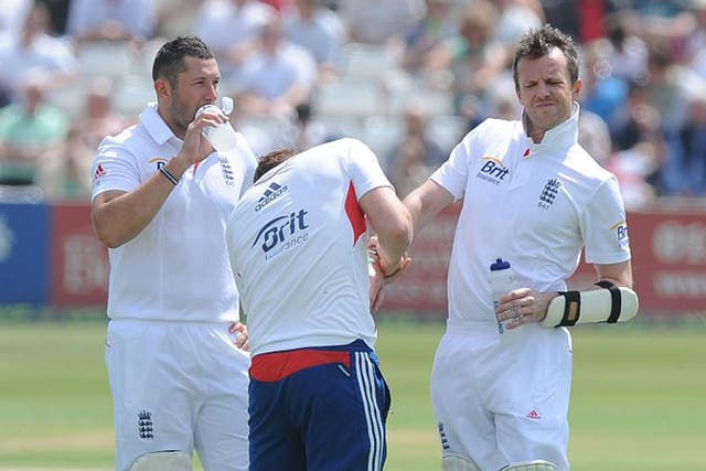 England’s Graeme Swann was given treatment after taking a ball to his forearm