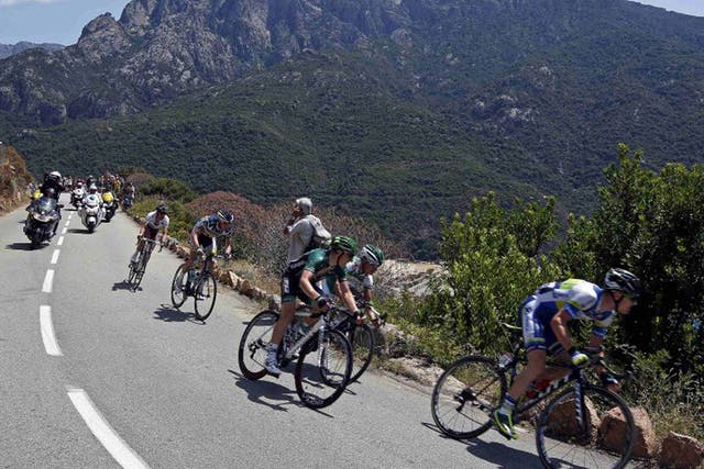 The peloton makes its way through Corsica’s rolling hills