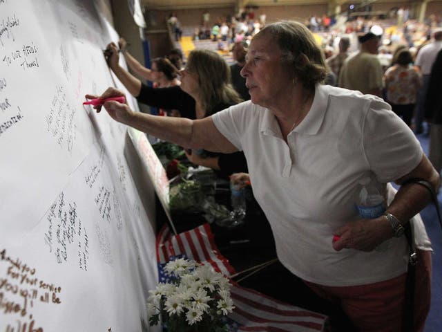 More than 1,000 people packed an Arizona university gym to honour the bravery and sacrifice of 19 elite firefighters