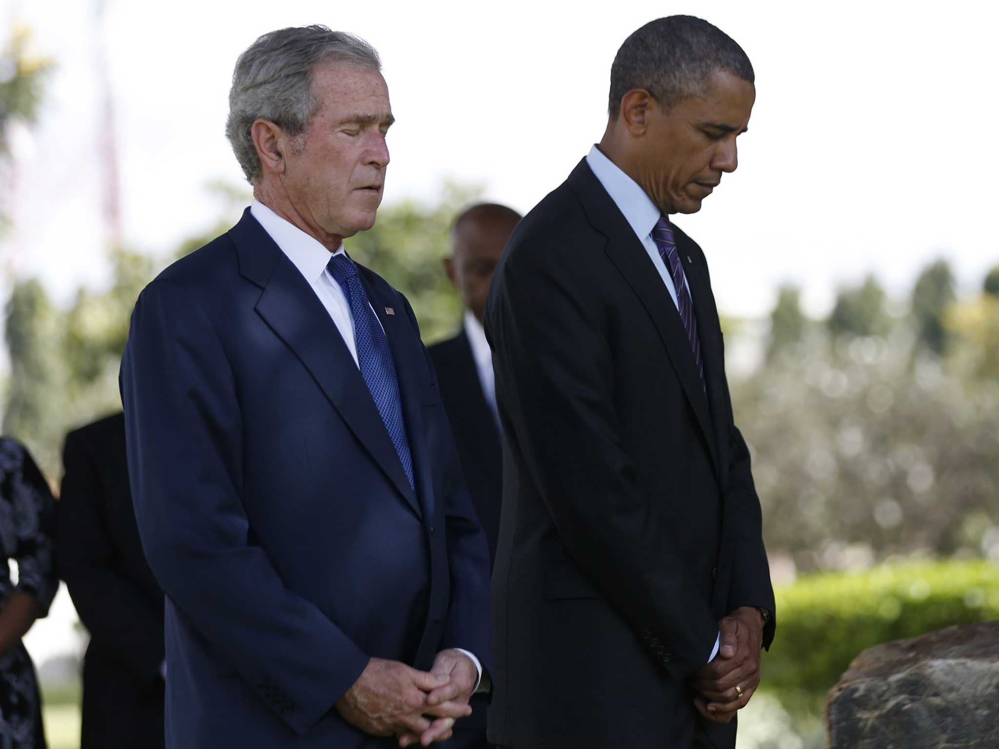Barack Obama and George W Bush attend a memorial for the victims of the 1998 US Embassy bombing in Dar es Salaam