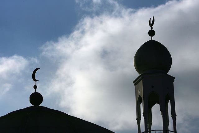 The minaret and dome of the Birmingham Central Mosque dominate the skyline as Muslims arrive for friday prayers on 2 February, 2007, Birmingham, England.