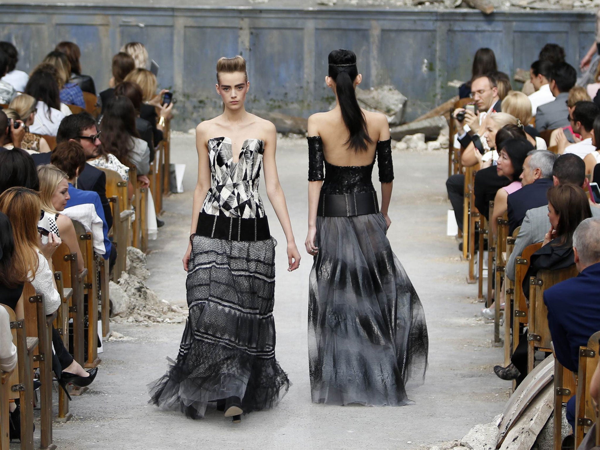 Models present creations by German designer Karl Lagerfeld as part of his Haute Couture Fall Winter 2013/2014 fashion show in Paris