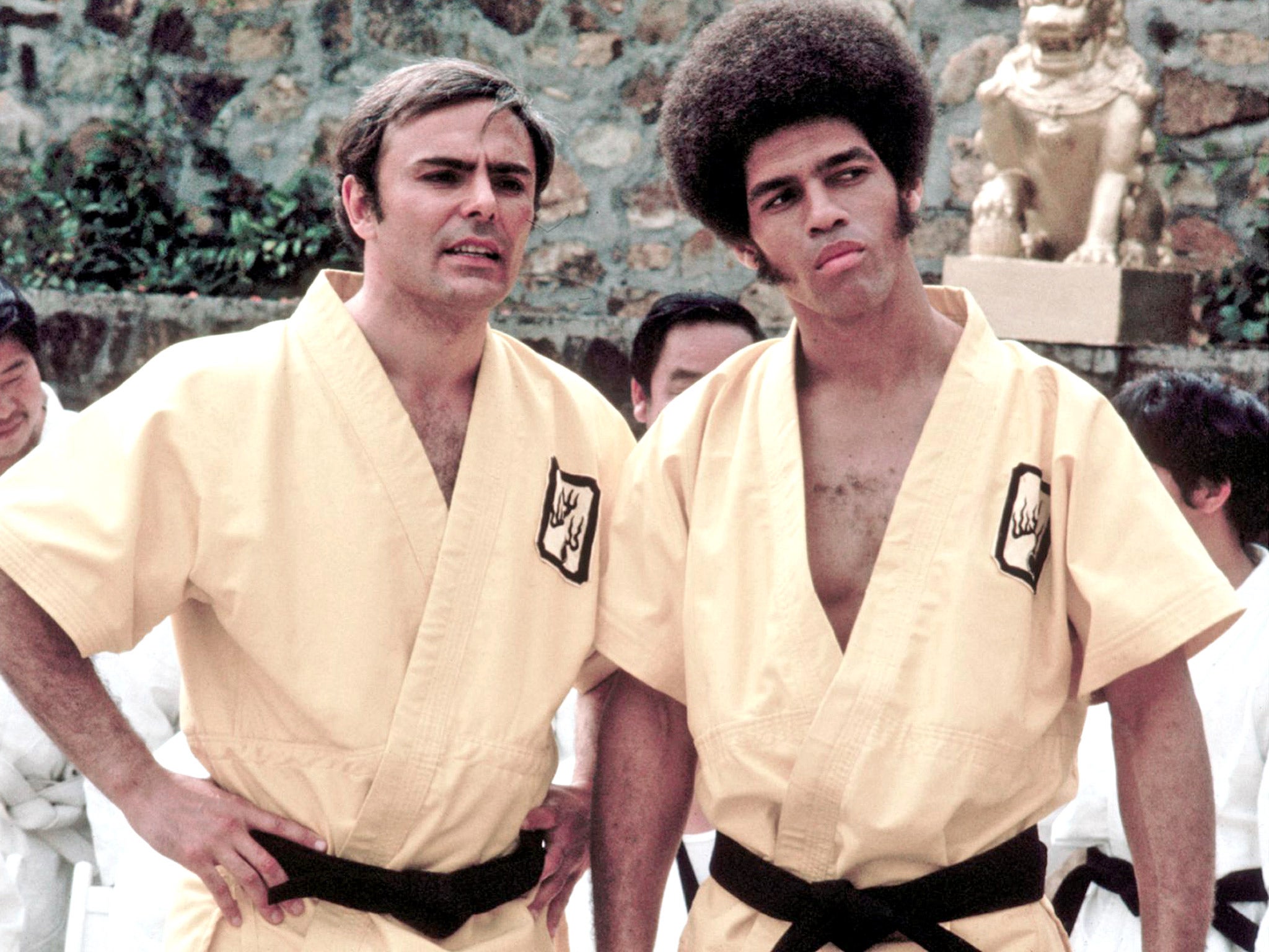 Kelly, right, with John Saxon in ‘Enter The Dragon’; he went on to make 10 films in the next six years