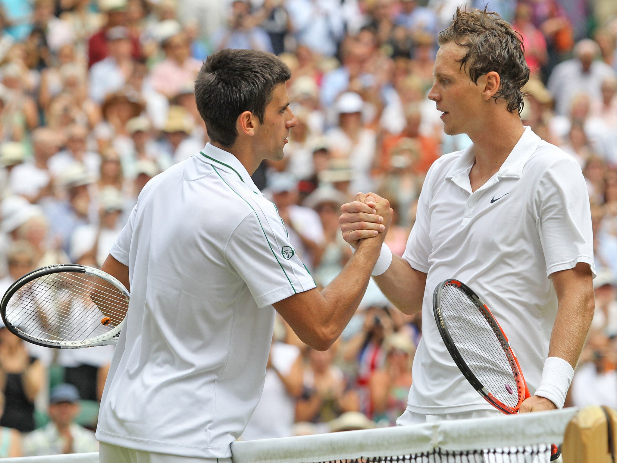 Novak Djokovic congratulates Tomas Berdych after their 2010 duel